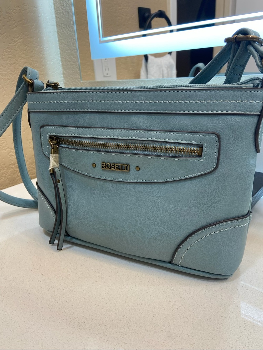 Rosetti Light Blue Faux-Leather Crossbody with Gold Accents Mini